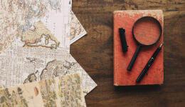 book-magnifying-glass-near-maps